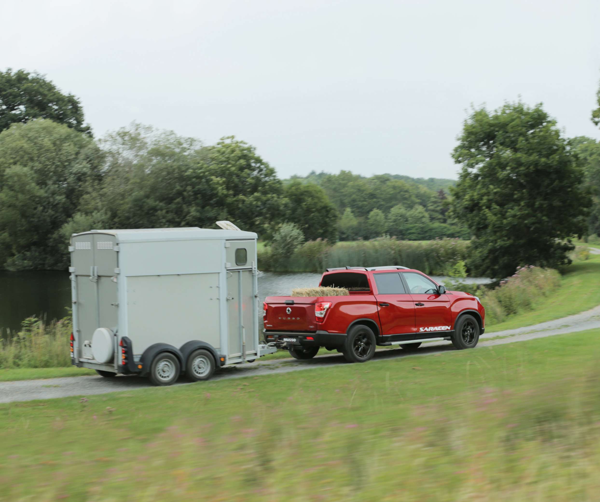 New SsangYong Musso photo shoot - towing with flat bed load